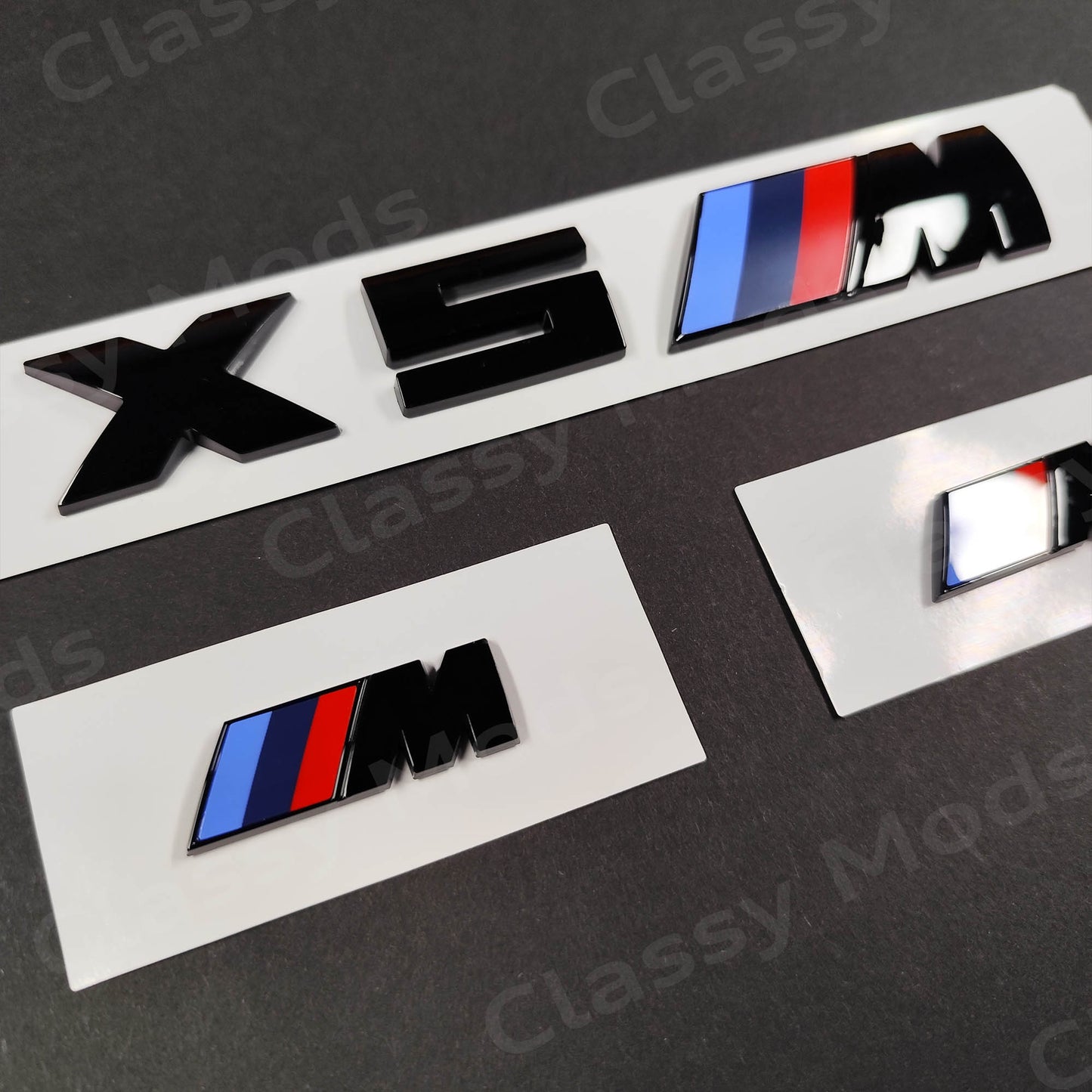 BMW X5M Gloss Black Badges Set