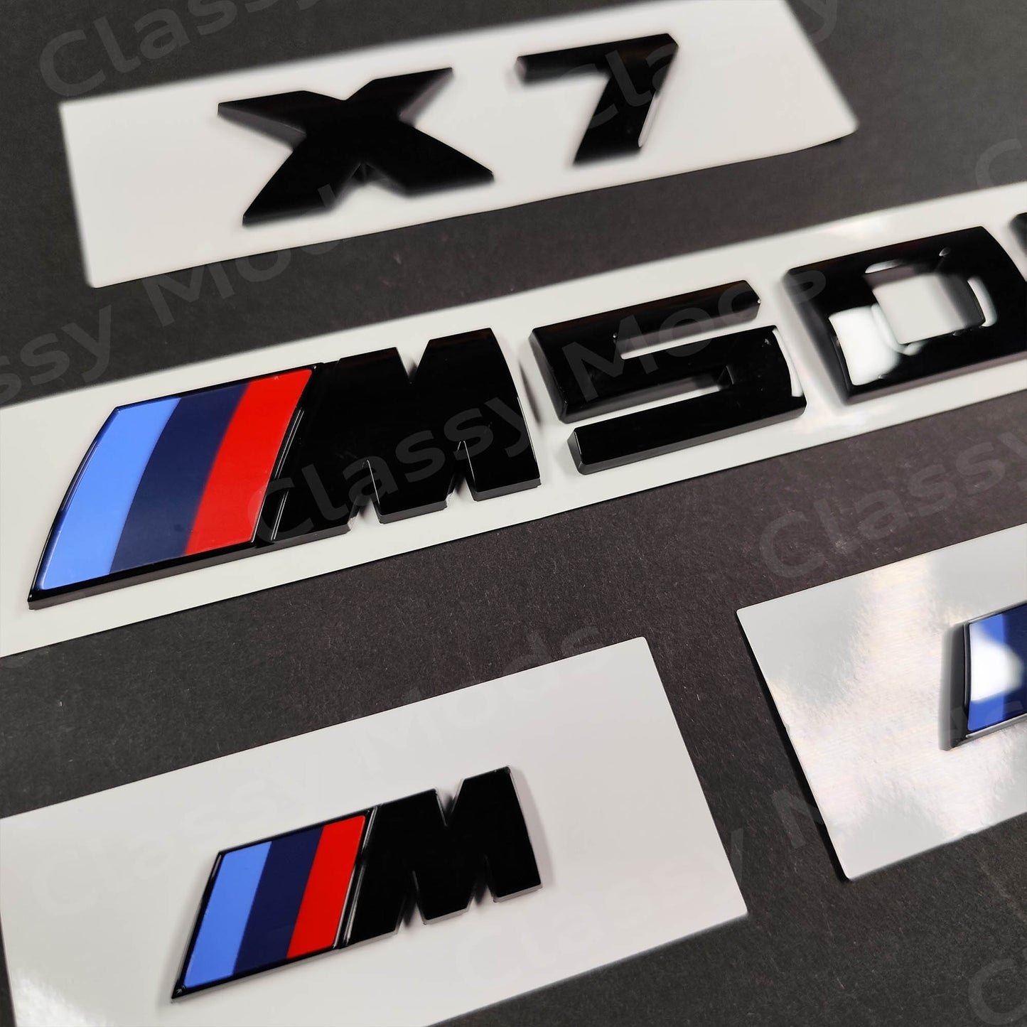 BMW X7 M50i Gloss Black Badges Set