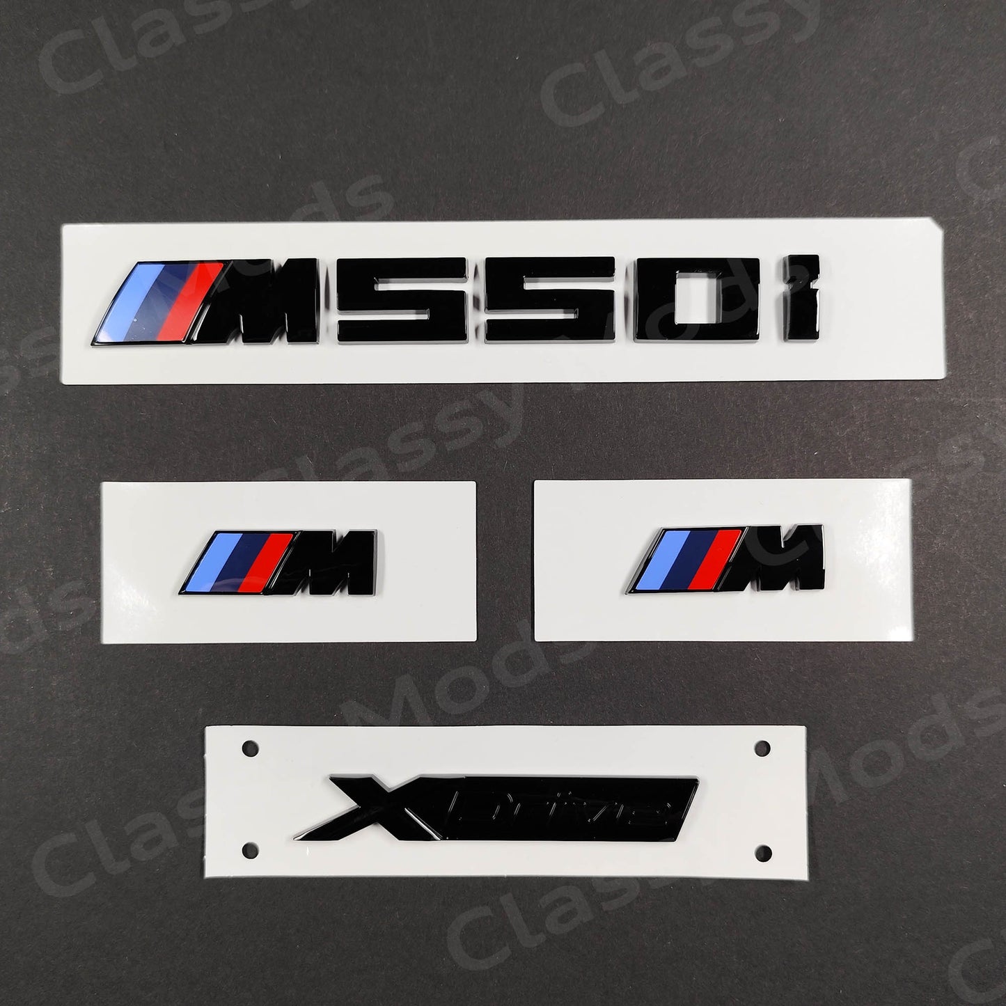 BMW M550i Gloss Black Badges Set