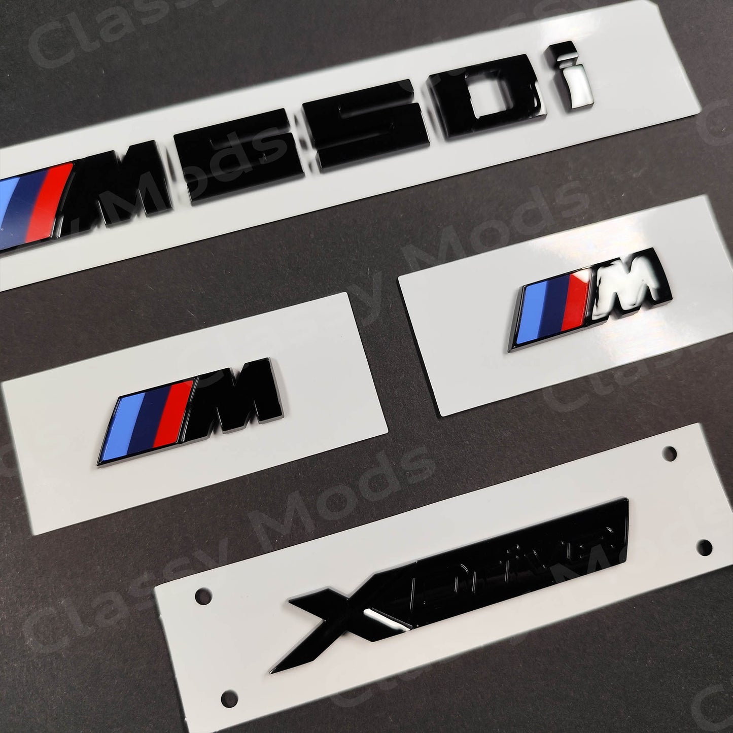 BMW M550i Gloss Black Badges Set