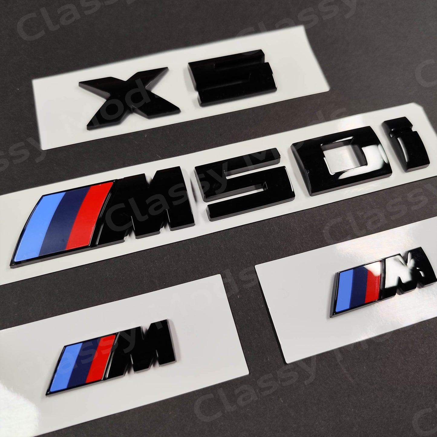 BMW X5 M50i Gloss Black Badges Set